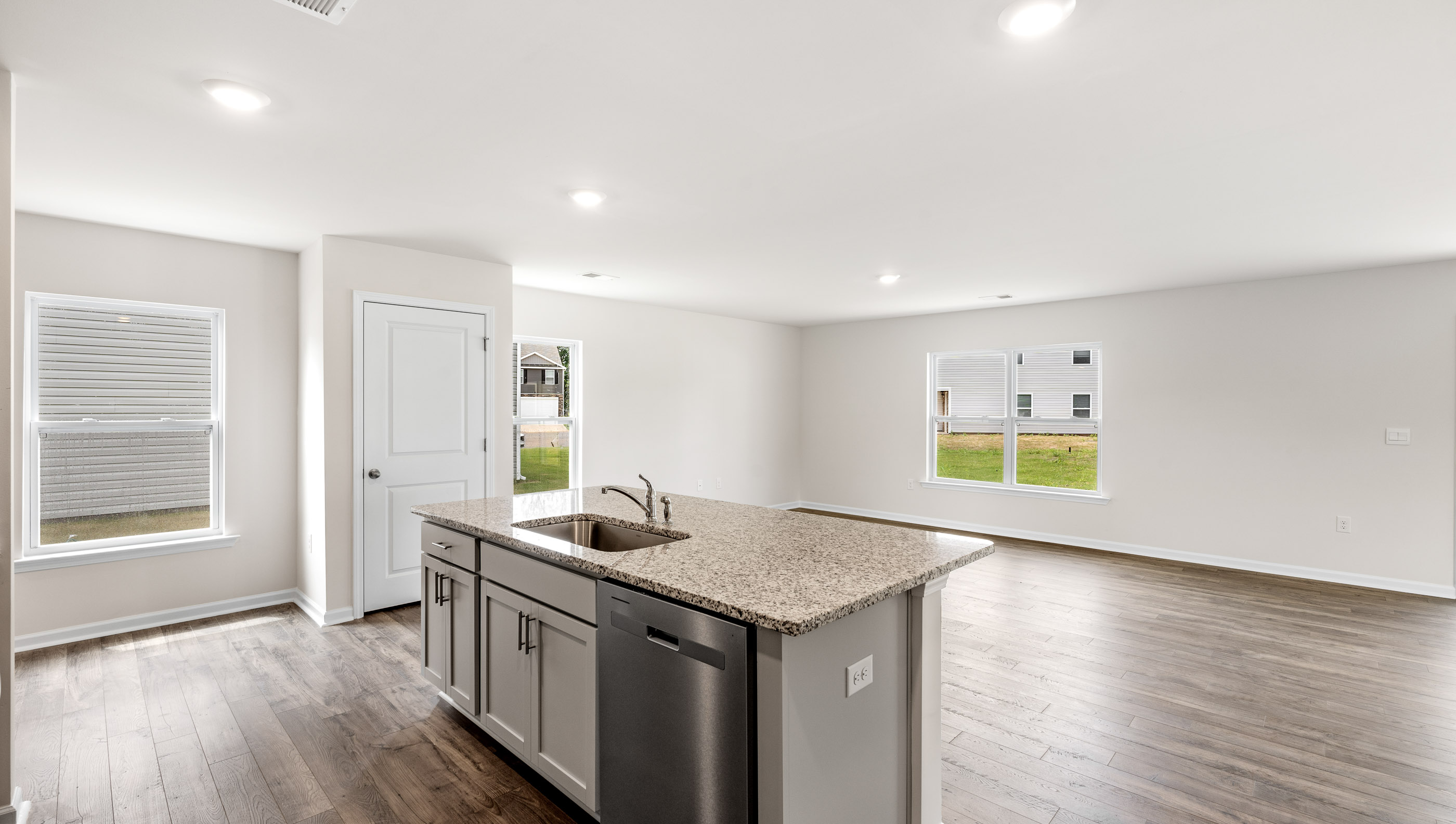 Kitchen and island with granite counter tops.