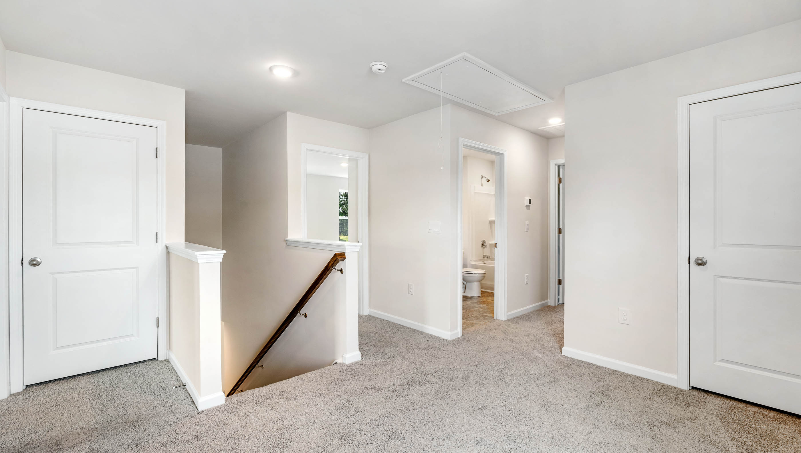 Loft area with carpet.
