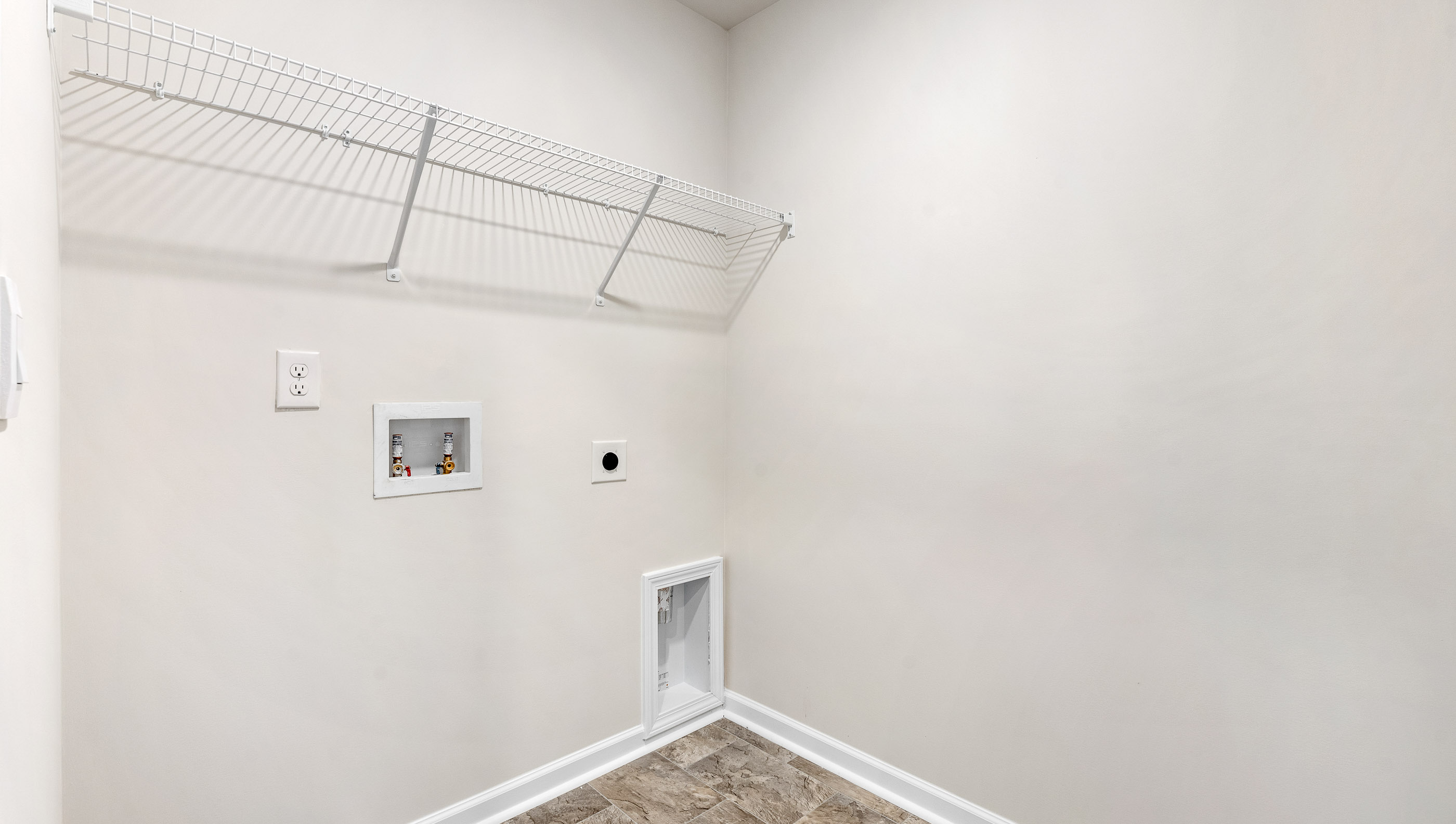 Laundry room with hanging storage racks,
