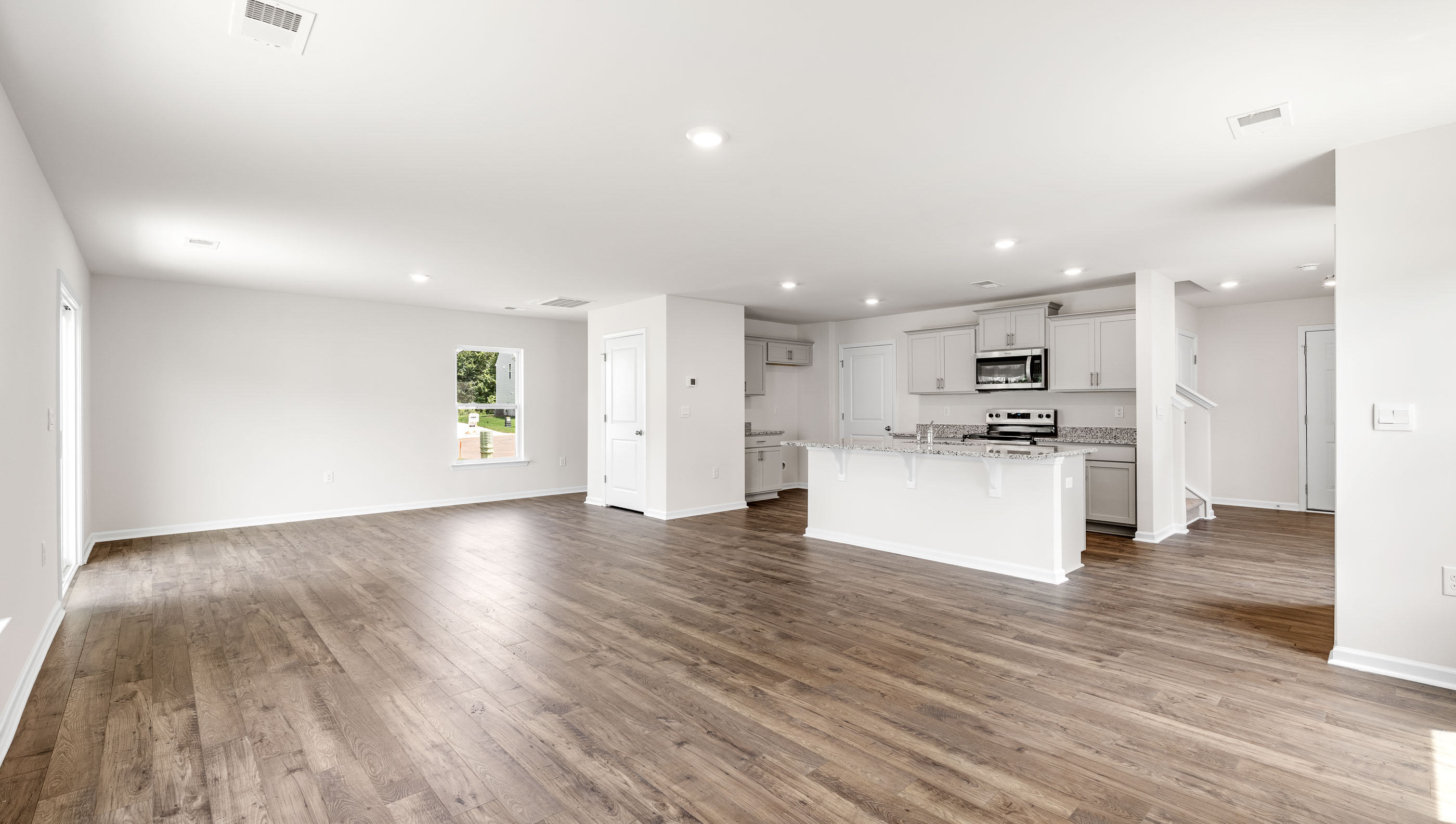 Kitchen and island with granite counter tops.
