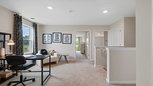 Loft area with carpet.