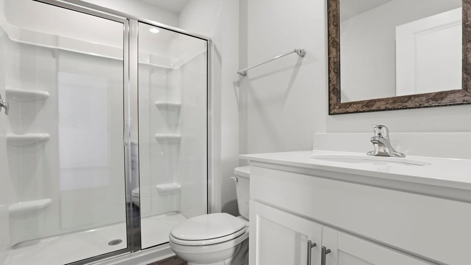 Bathroom with sink and walk in shower.