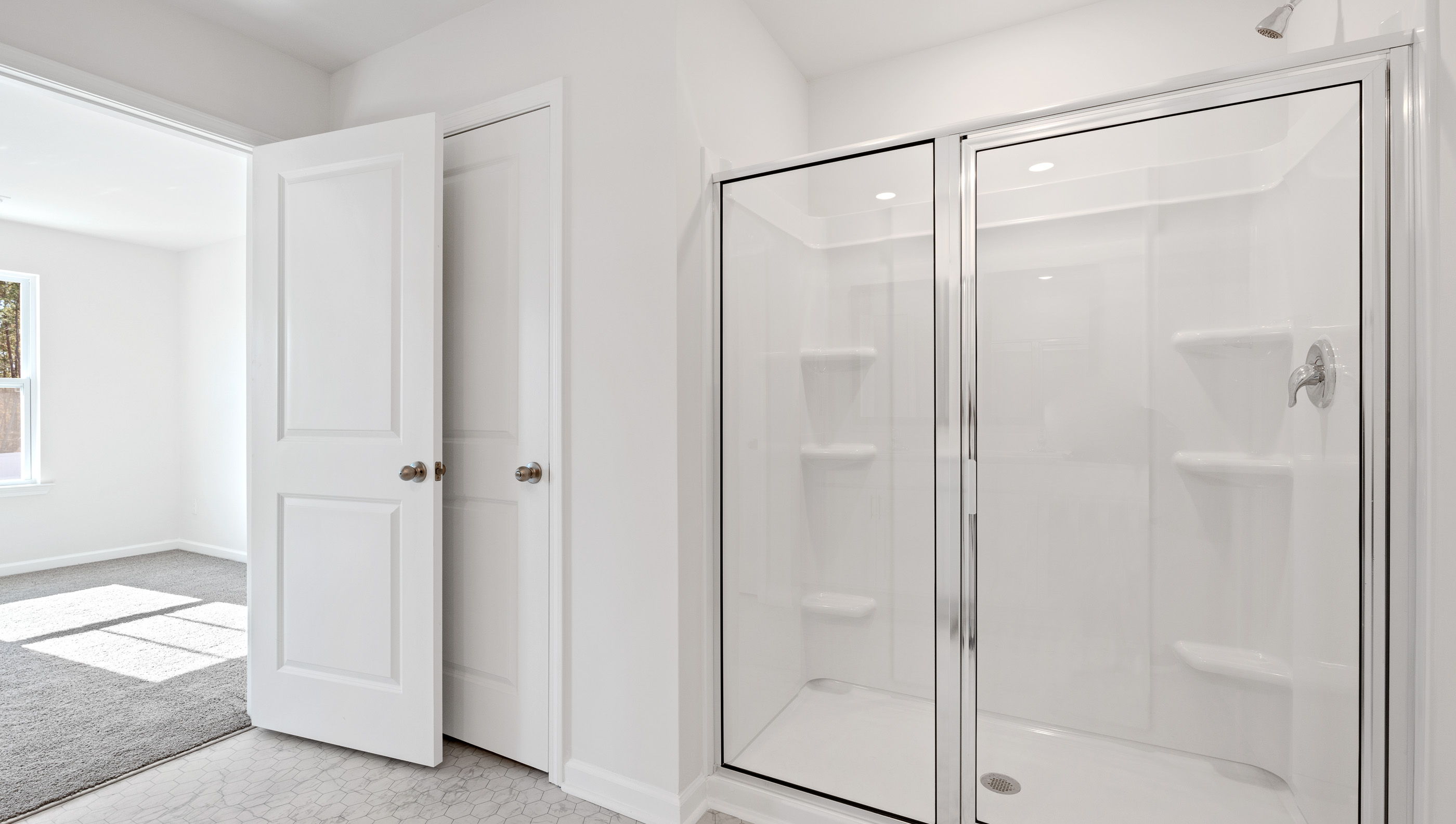 Walk in shower in bathroom.