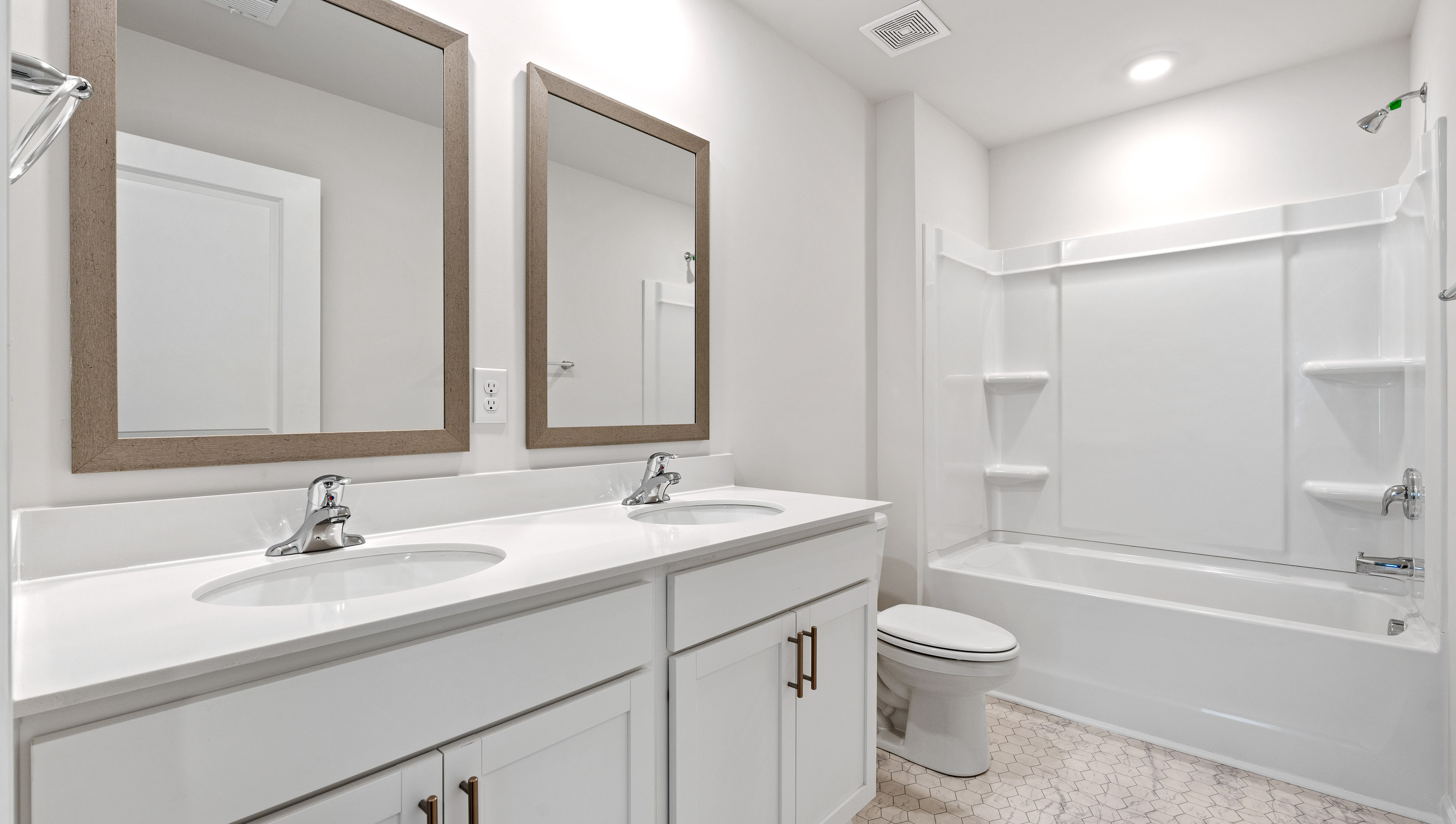 Bathroom with walk in shower and vanity.
