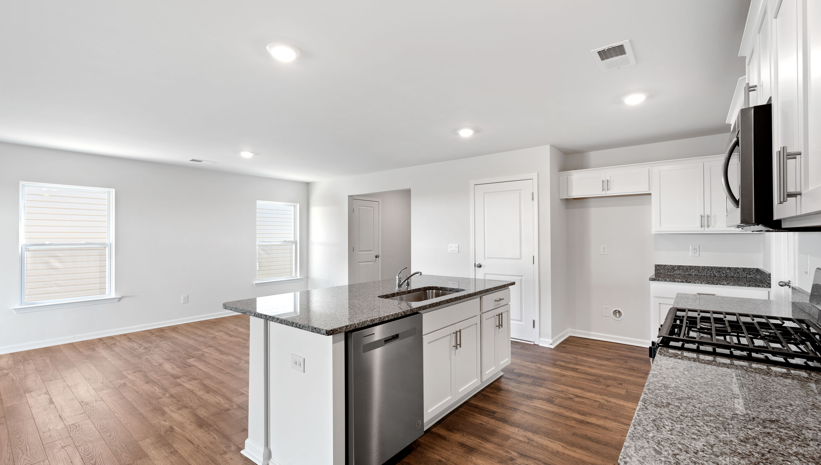 Kitchen with island and countertops.