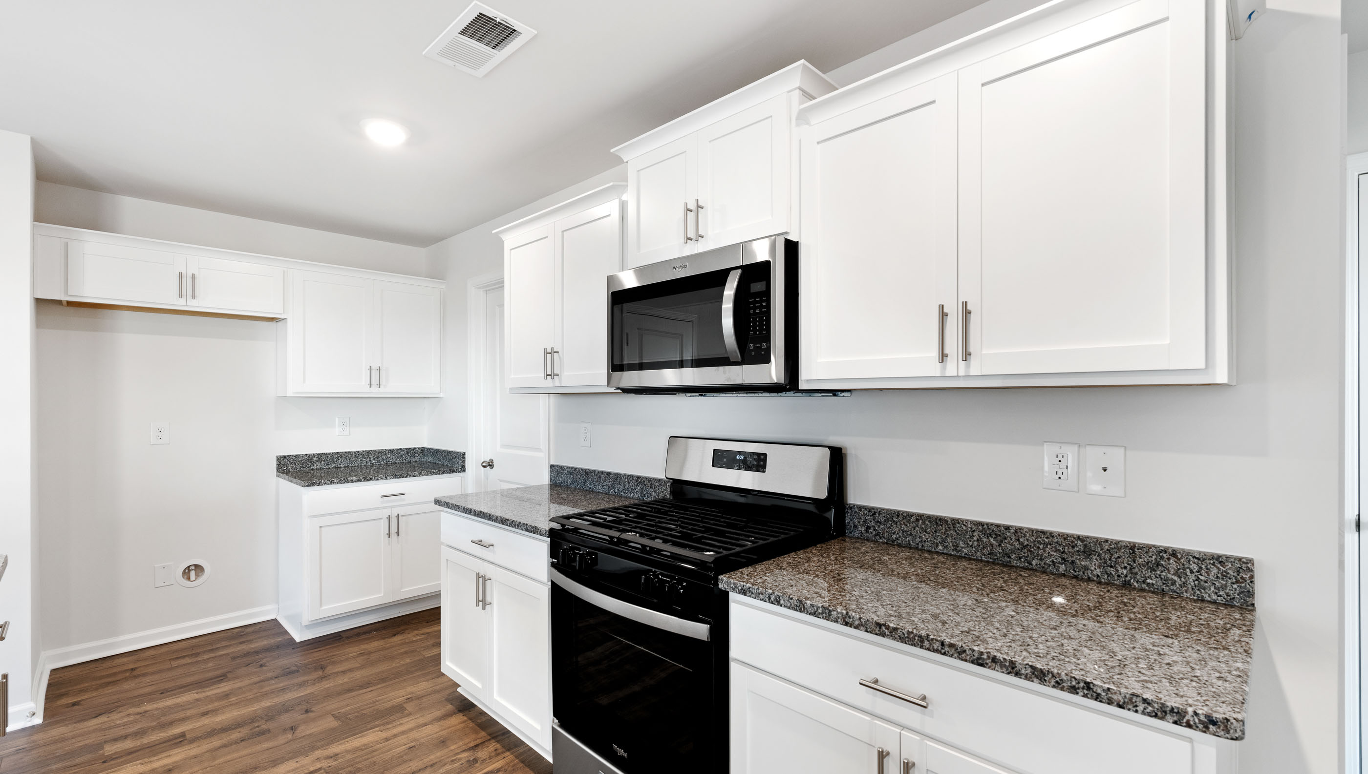 Kitchen with island and countertops.