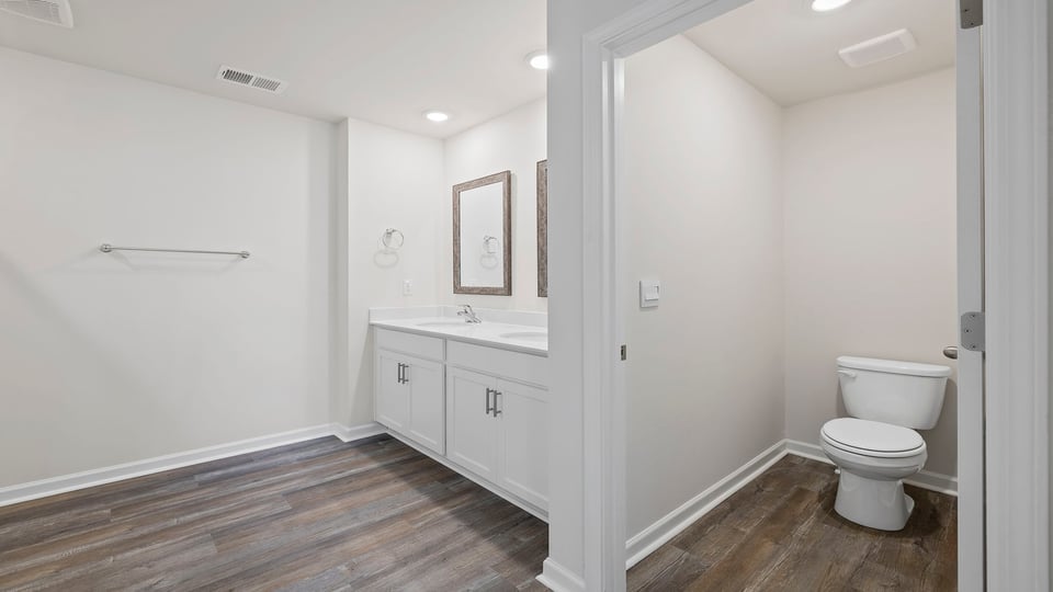 Bathroom with dual vanity.