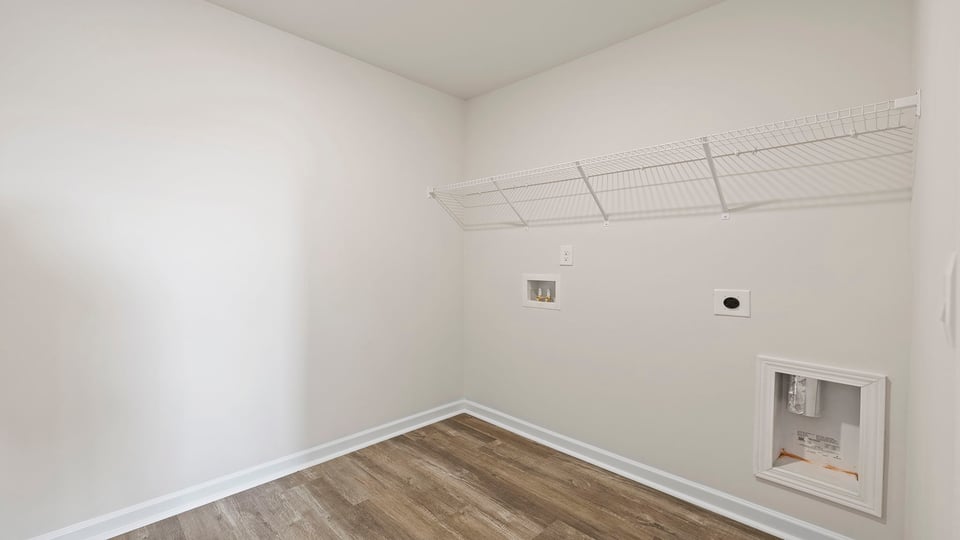 Walk in laundry with shelves.