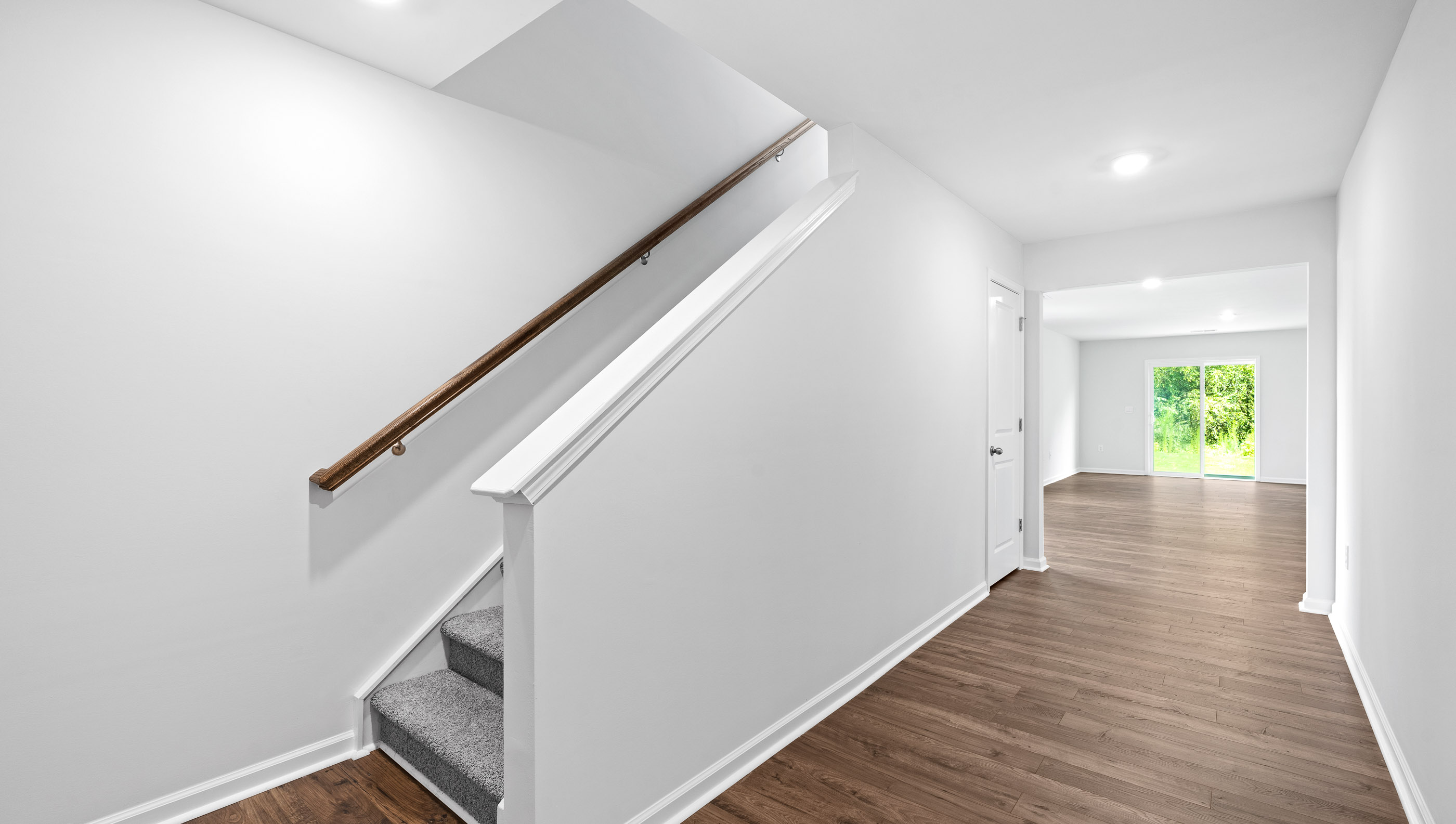 Entry way into home with stiars.