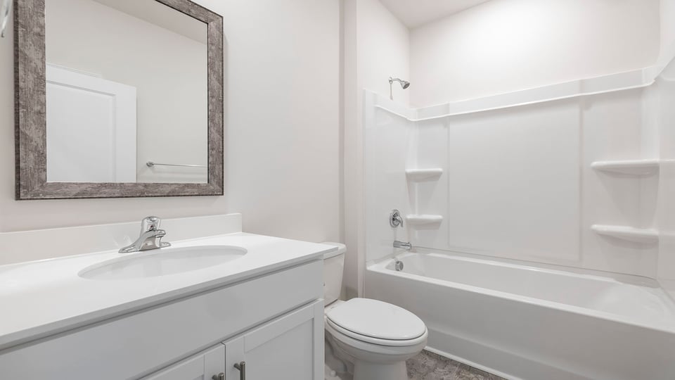 Bathroom with vanity and tub.