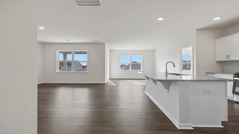 Kitchen and island with granite countertops.