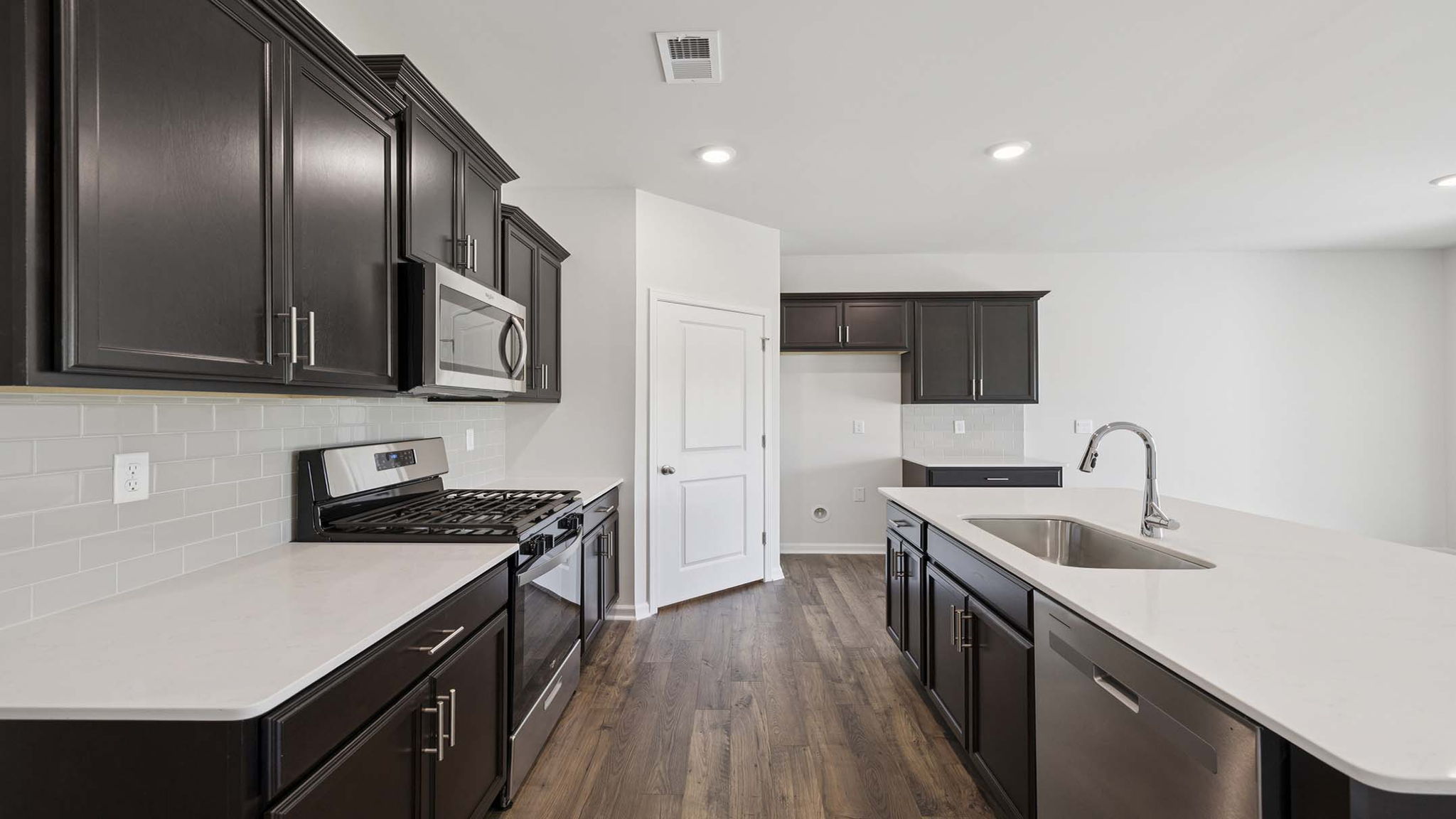 Kitchen and island with granite countertops.