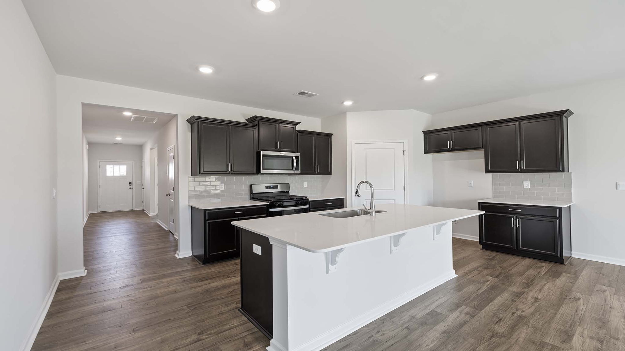 Kitchen and island with granite countertops.