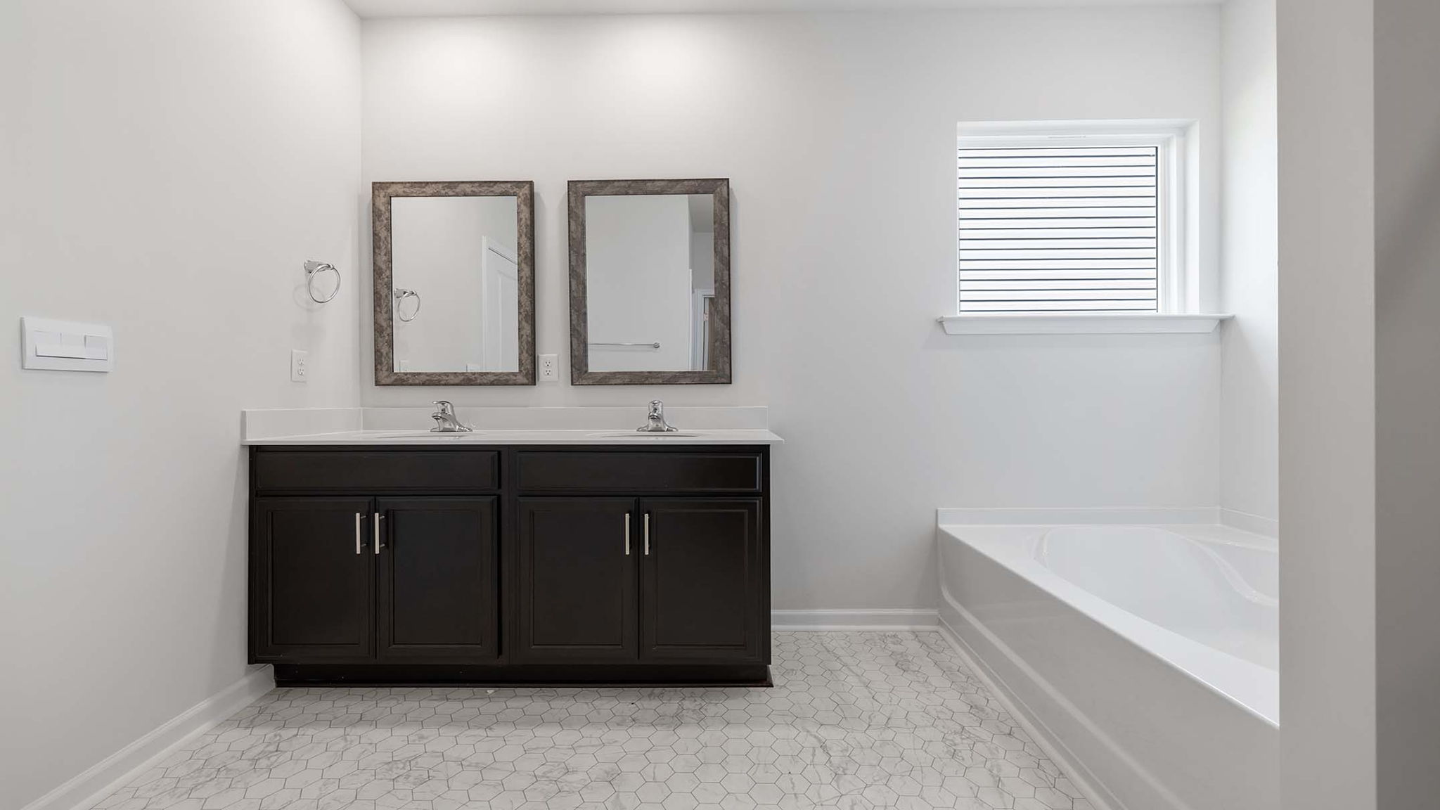 Bathroom with dual vanity.