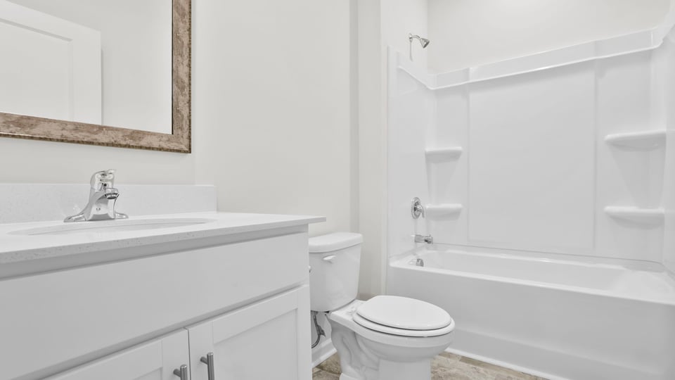 Bathroom with tub and vanity.