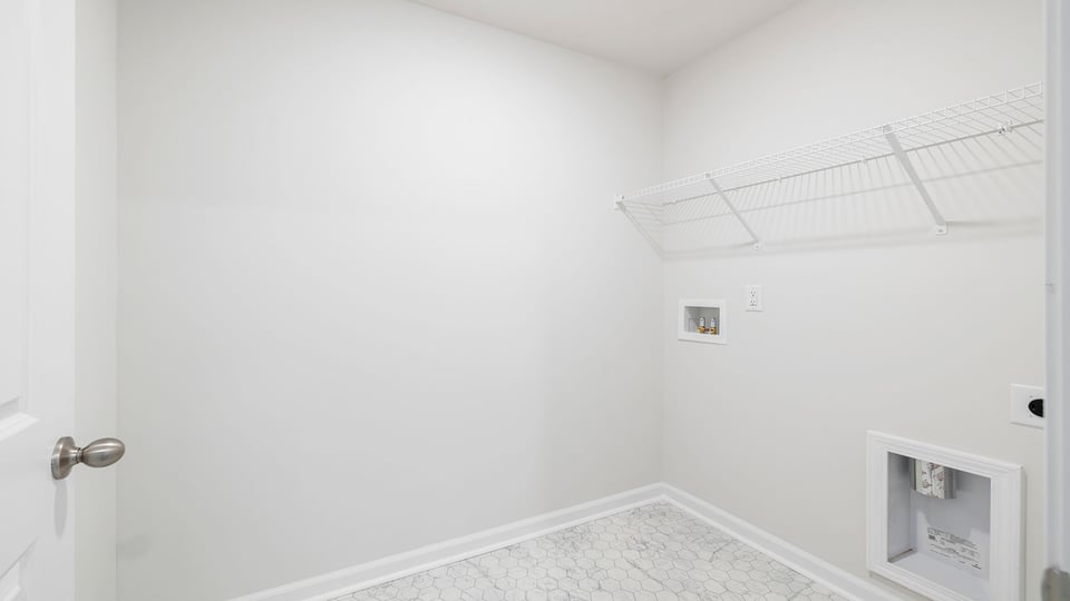 Walk in laundry with shelves.