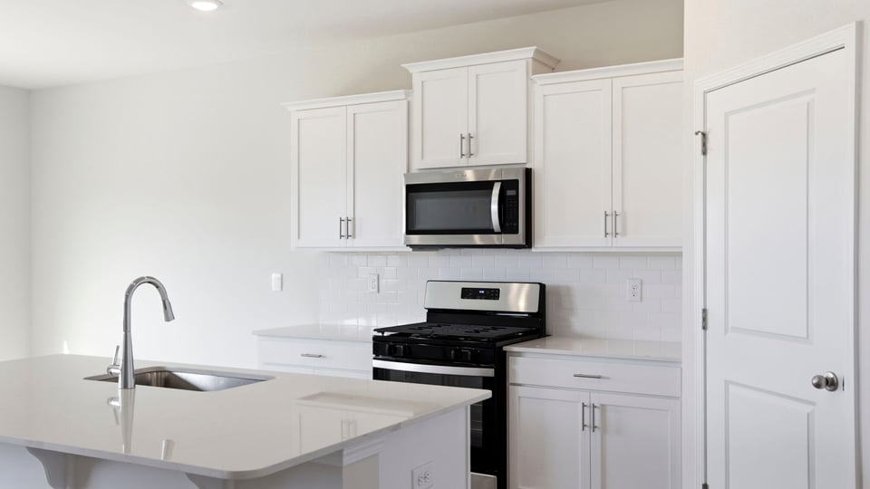 Kitchen with island and countertops.