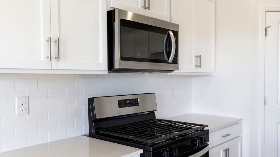 Kitchen with island and countertops.