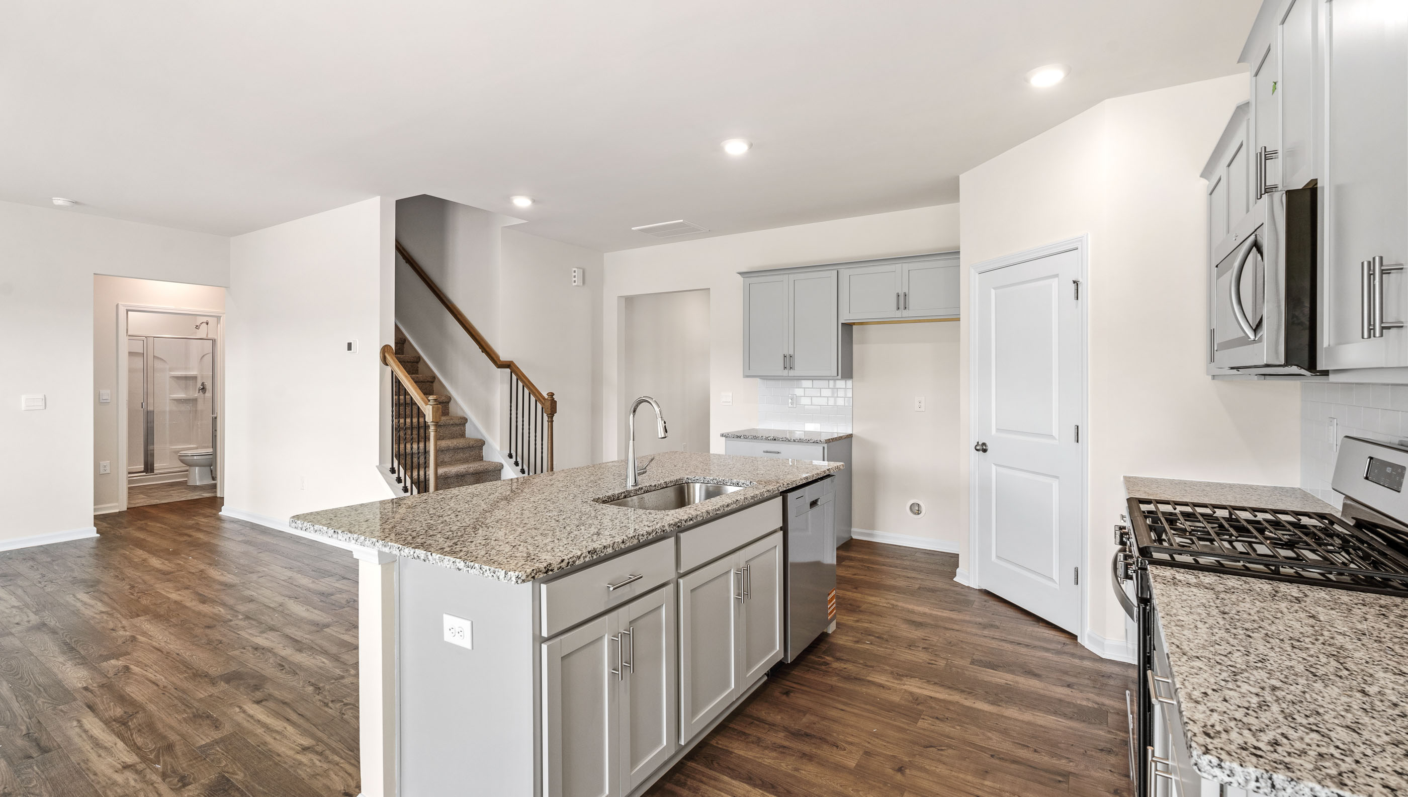 Kitchen with island with granite countertops.