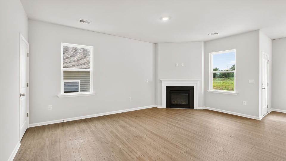 Living area with fireplace and windows