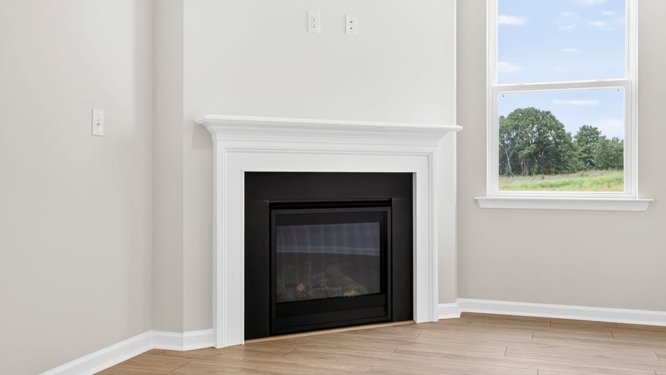 Living area with fireplace and windows