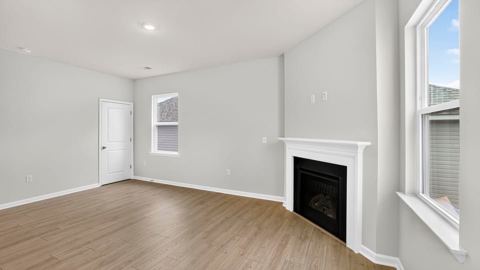 Living area with fireplace and windows