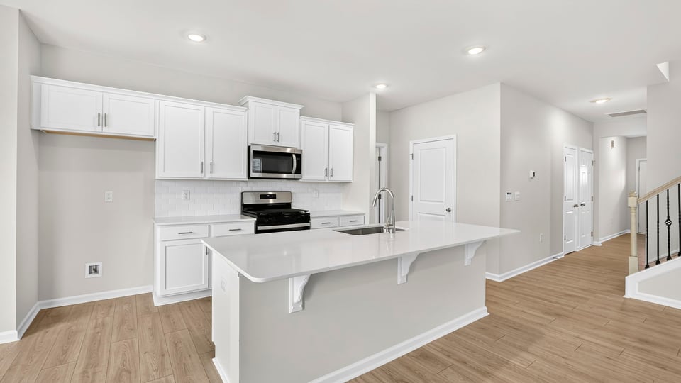 Living area view of full kitchen