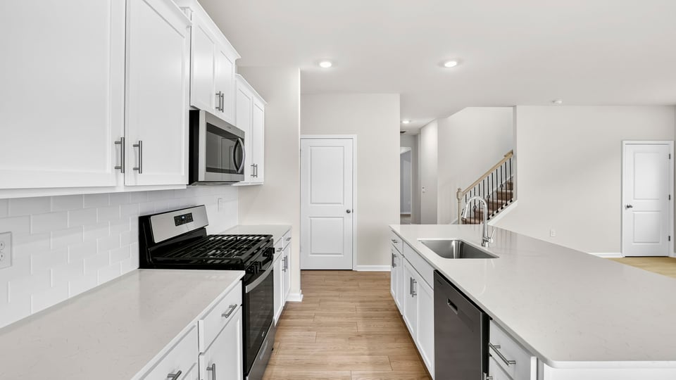 Kitchen view with island and appliances