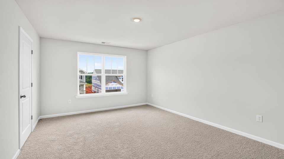 Upstairs bedroom with carpet andwindows and closet