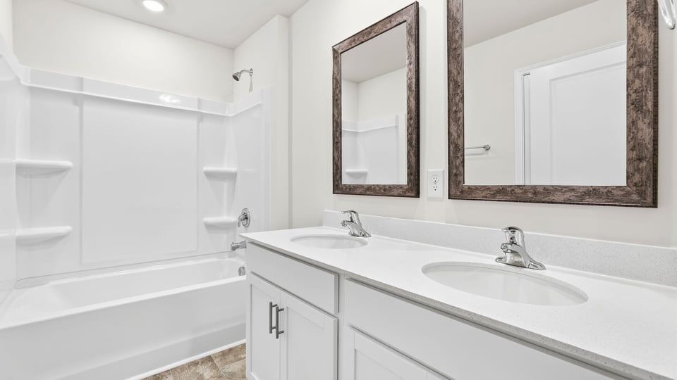 Upstairs bathroom with double vanity sink