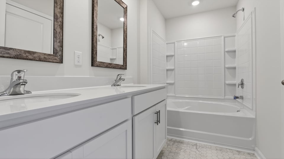Bathroom with vanity and tub.