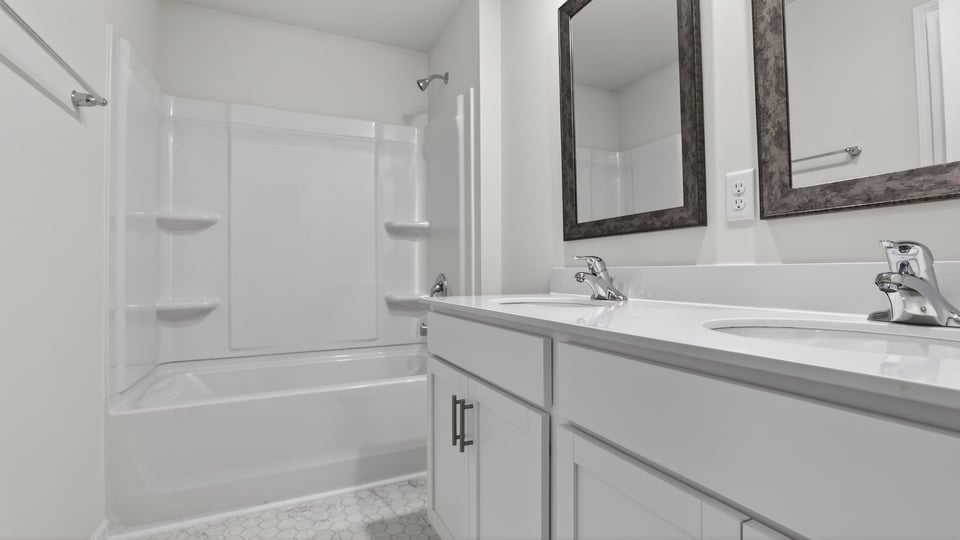 Bathroom with vanity and tub.