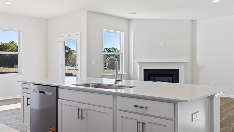Kitchen with island and countertops.