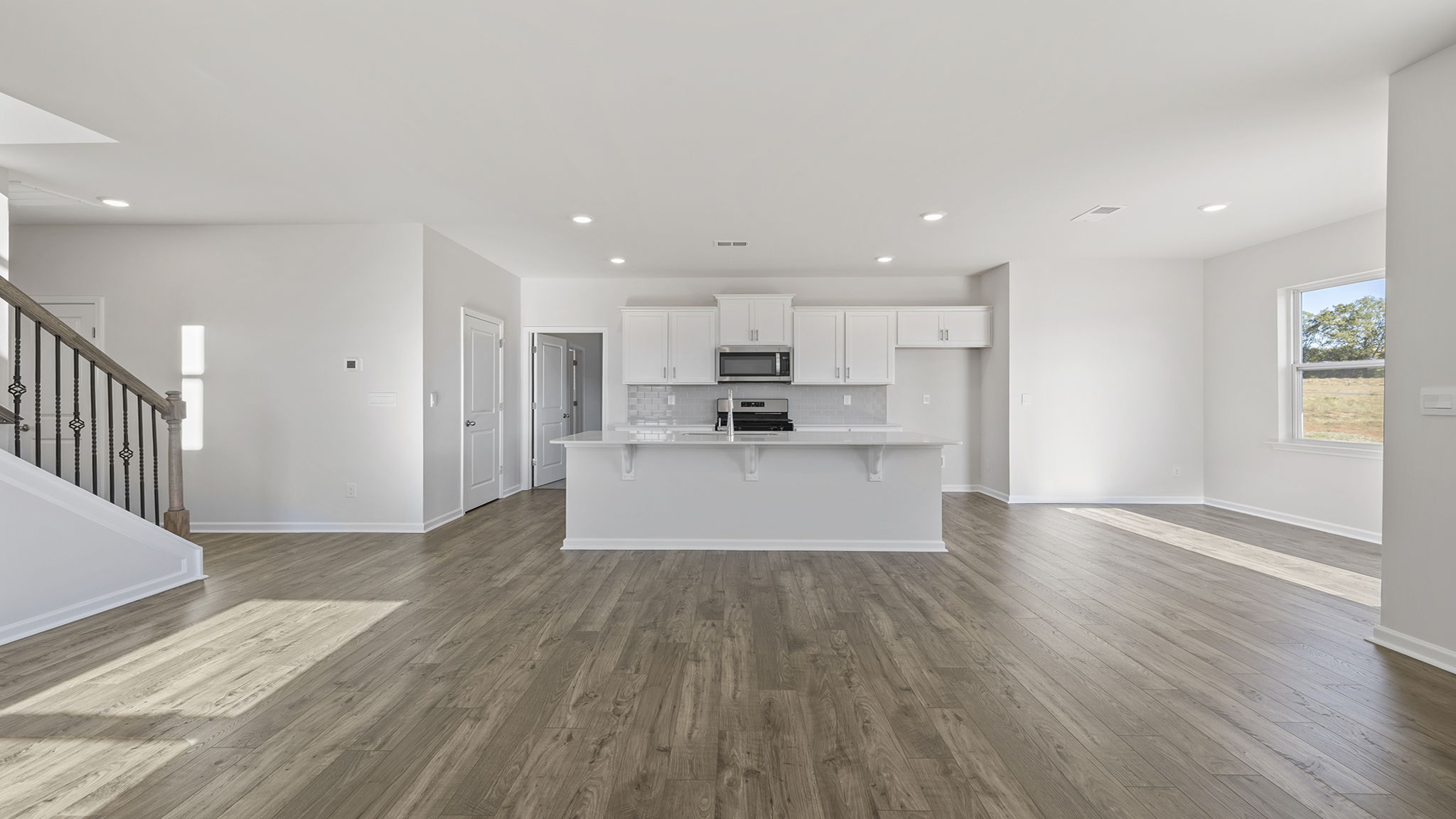 Kitchen and island with granite countertops.