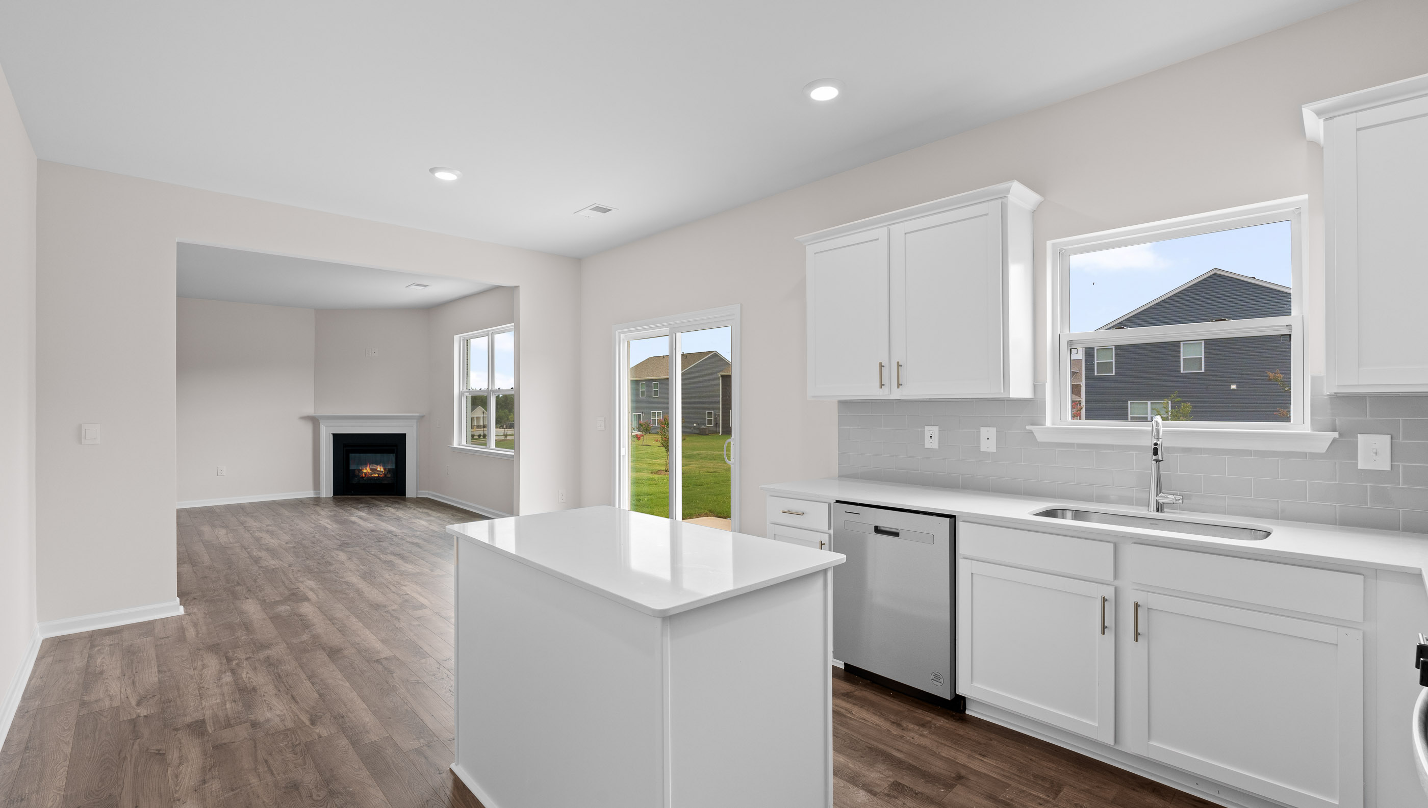 Family room with windows and fireplace.