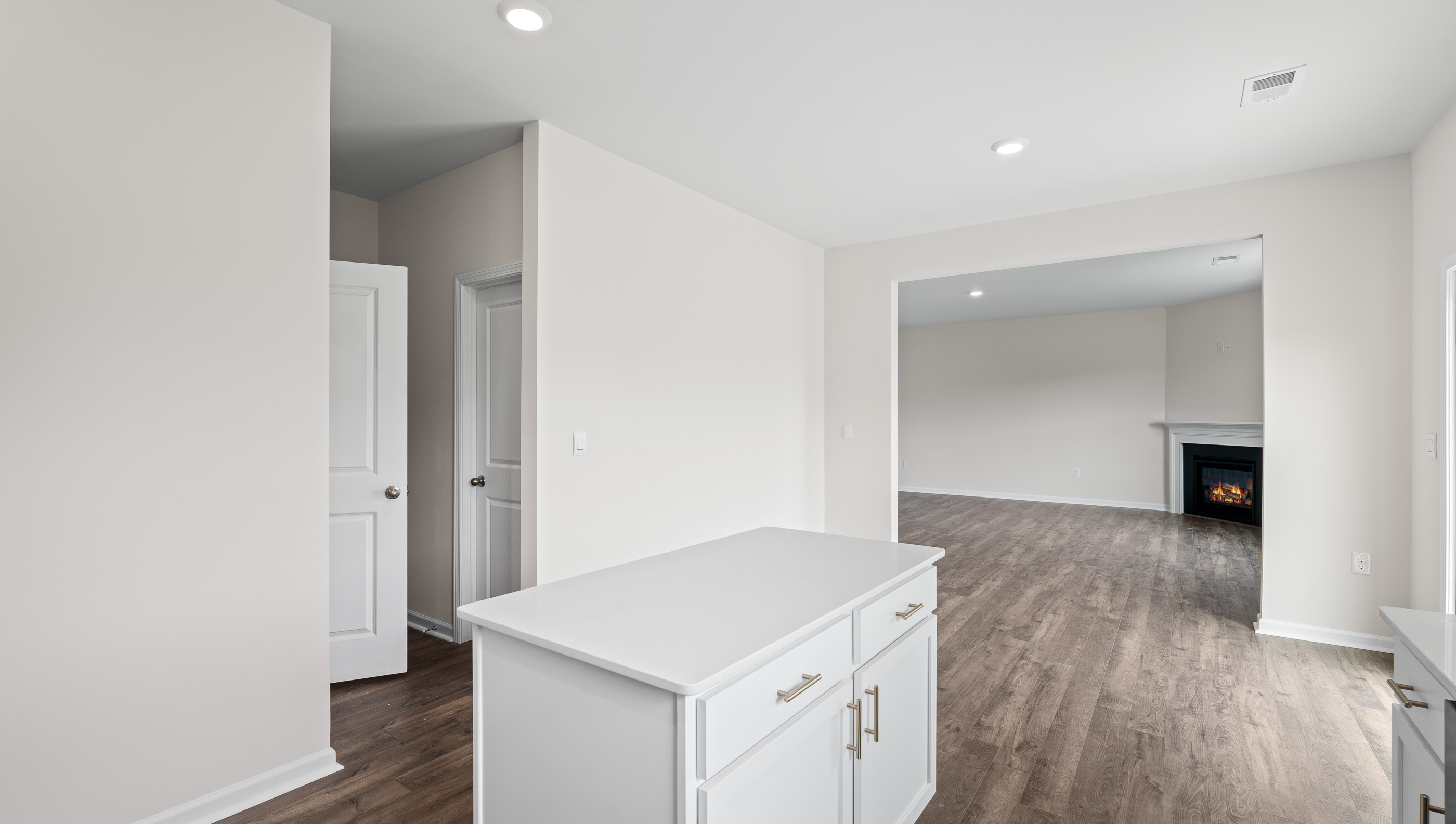 Family room with windows and fireplace.