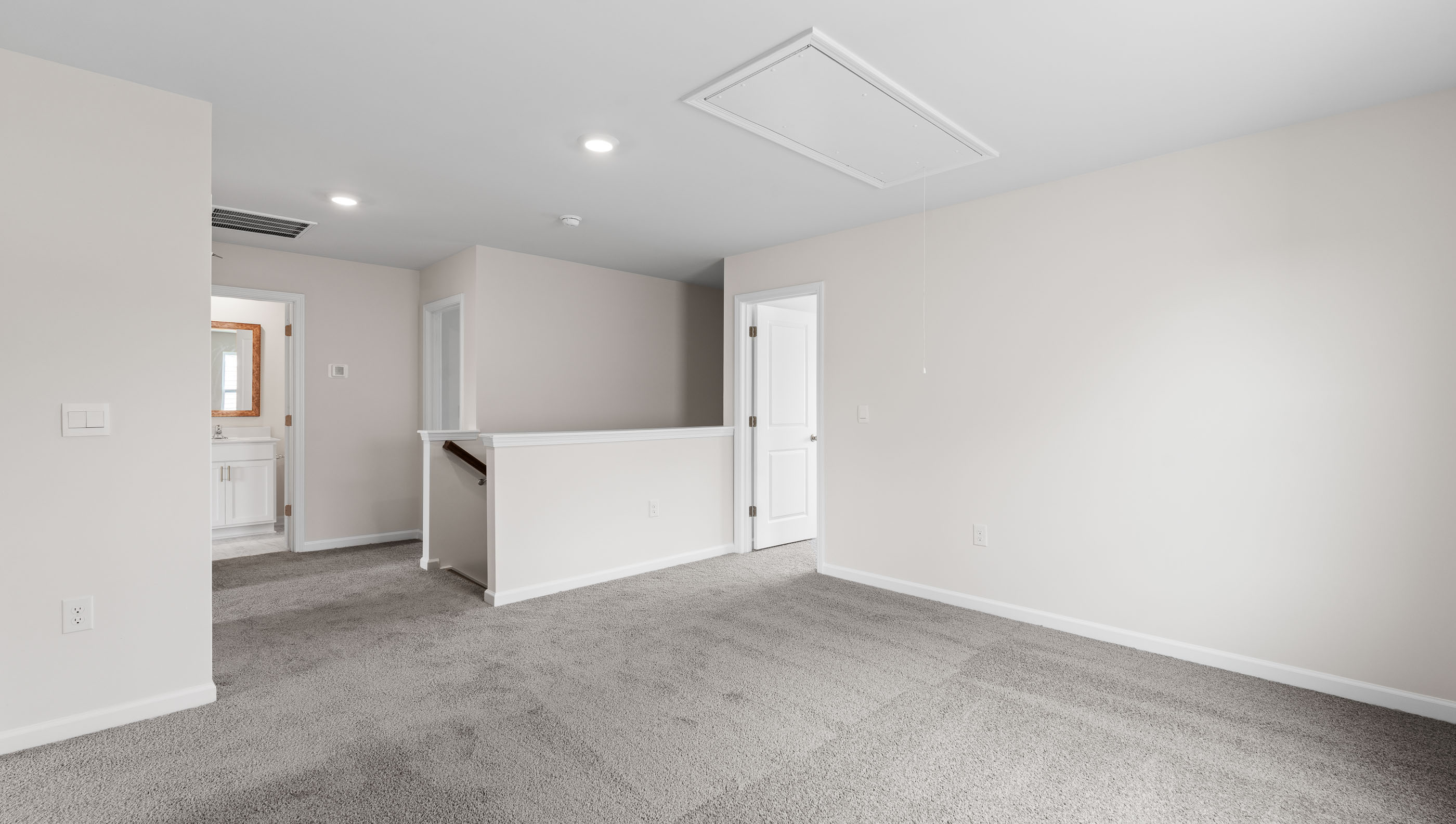 Loft area with carpet.