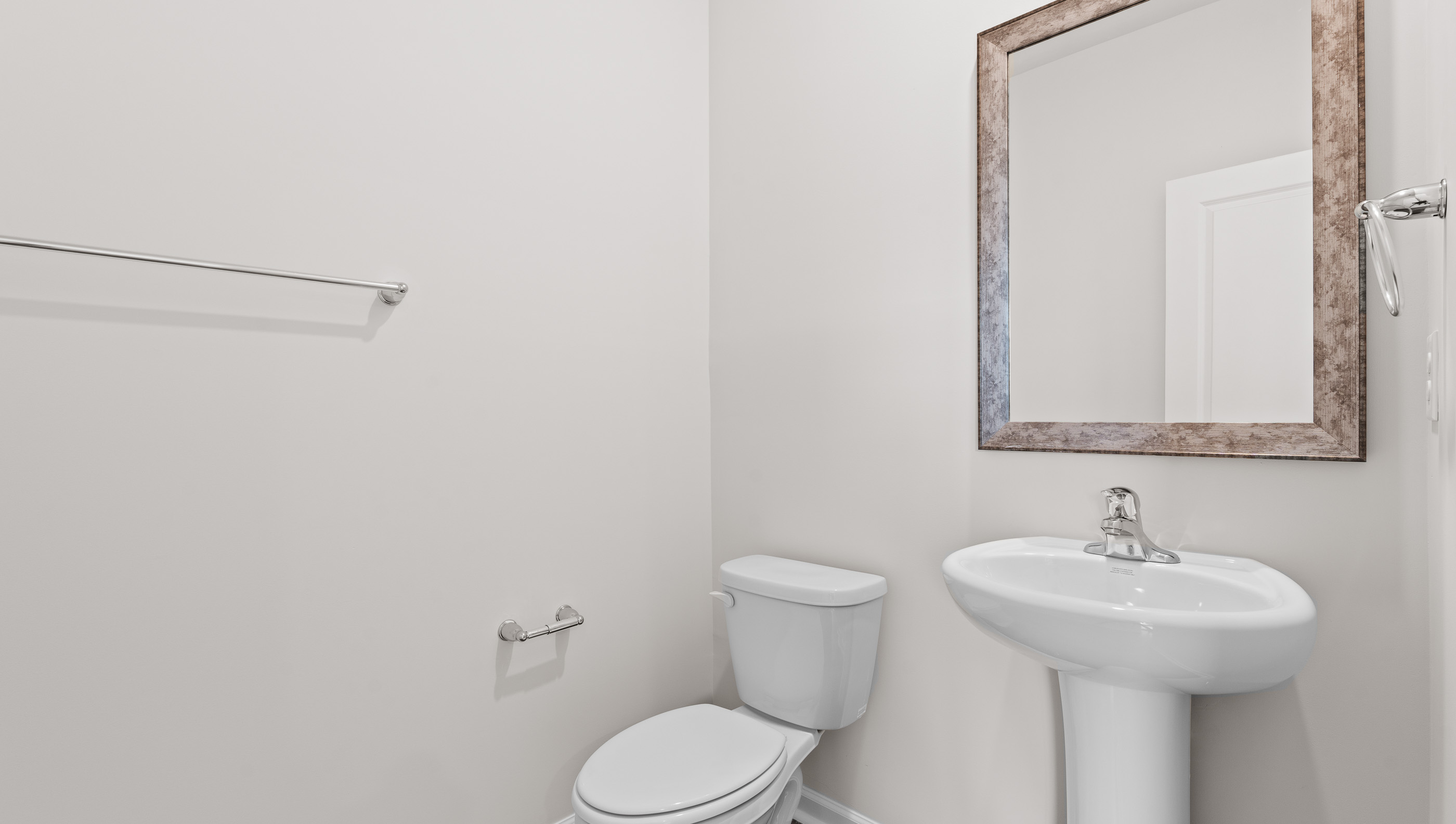 Half bath with toilet and sink.