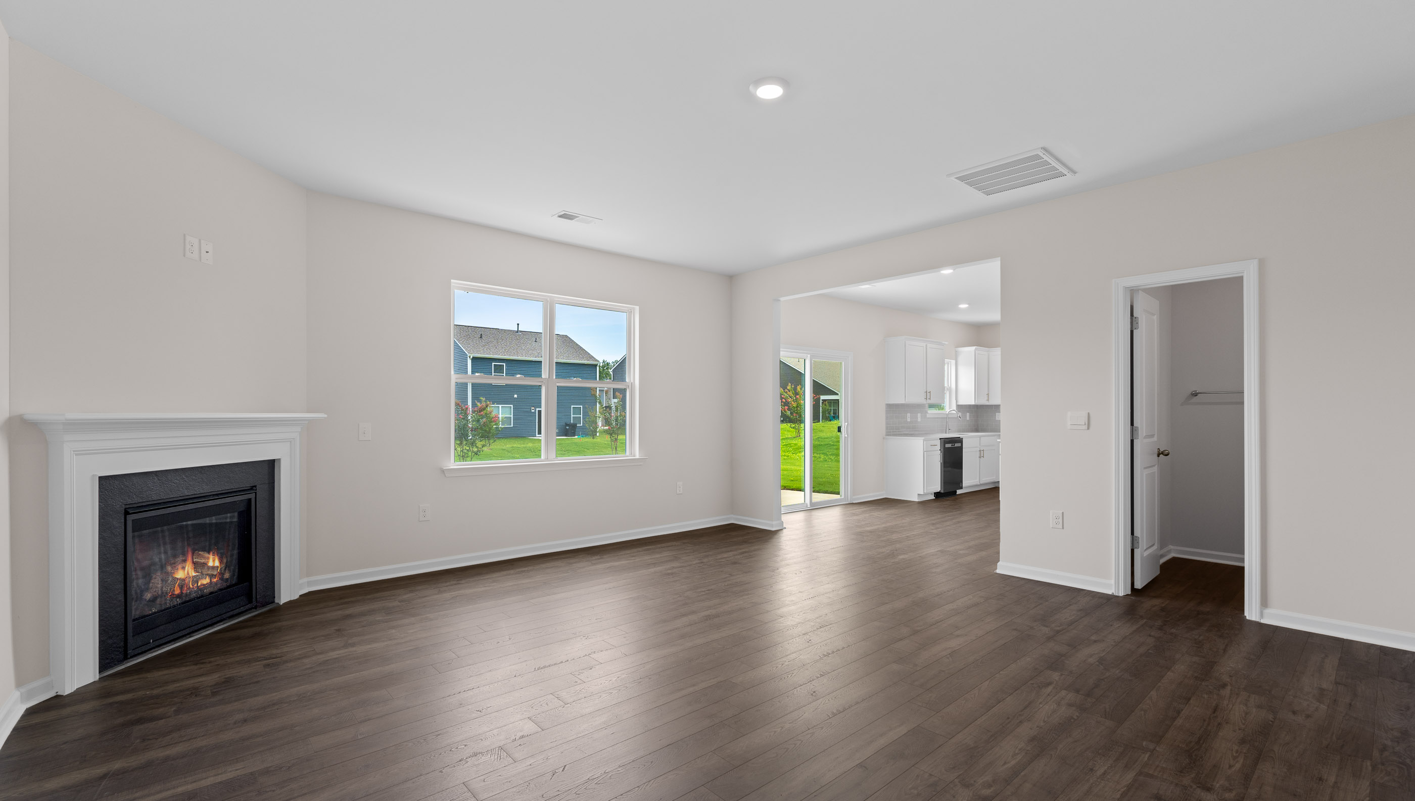 Family room with windows and fireplace.