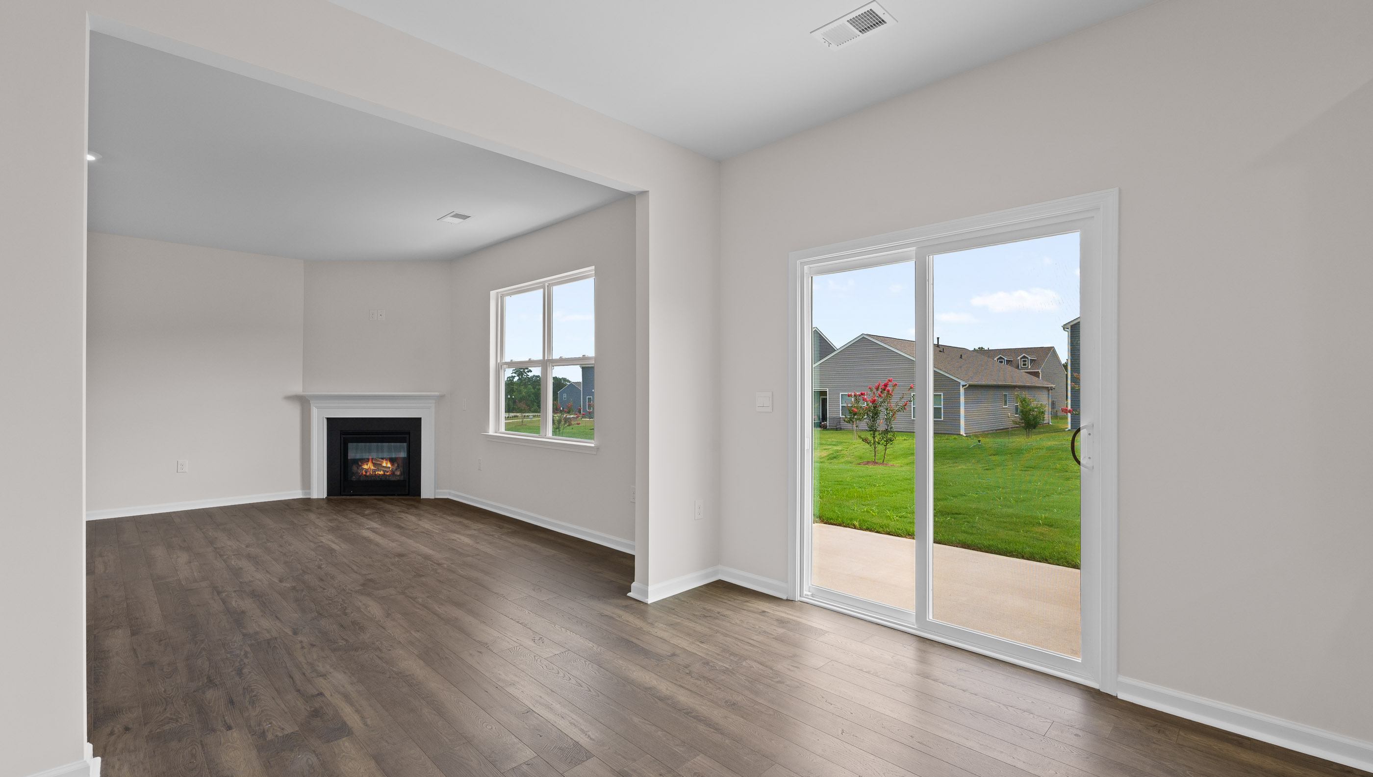 Family room with windows and fireplace.