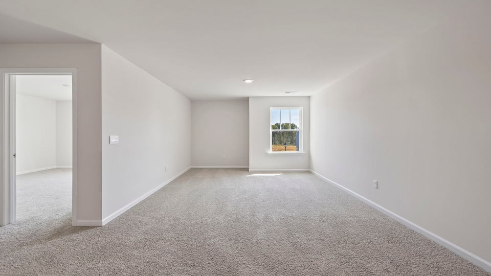 Loft with carpet.