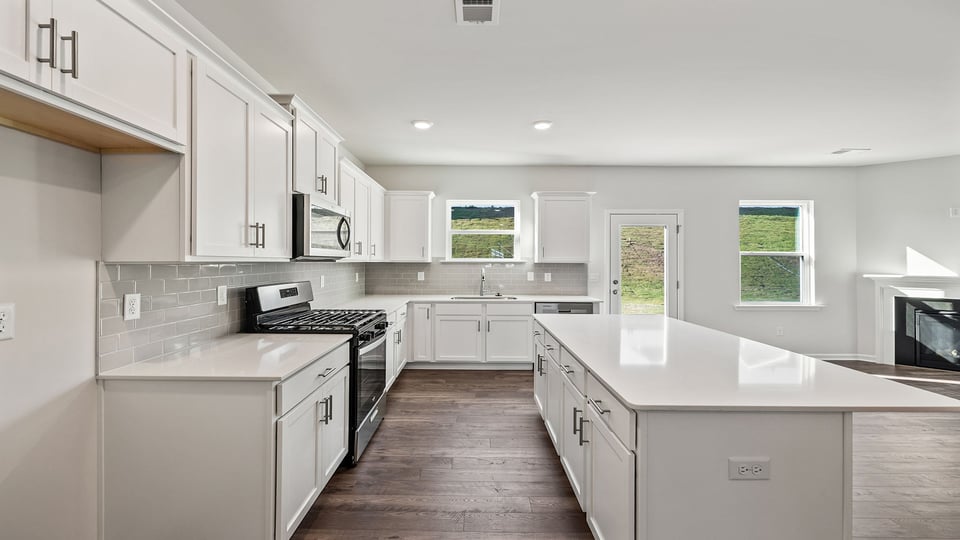 Kitchen and island with granite countertops.