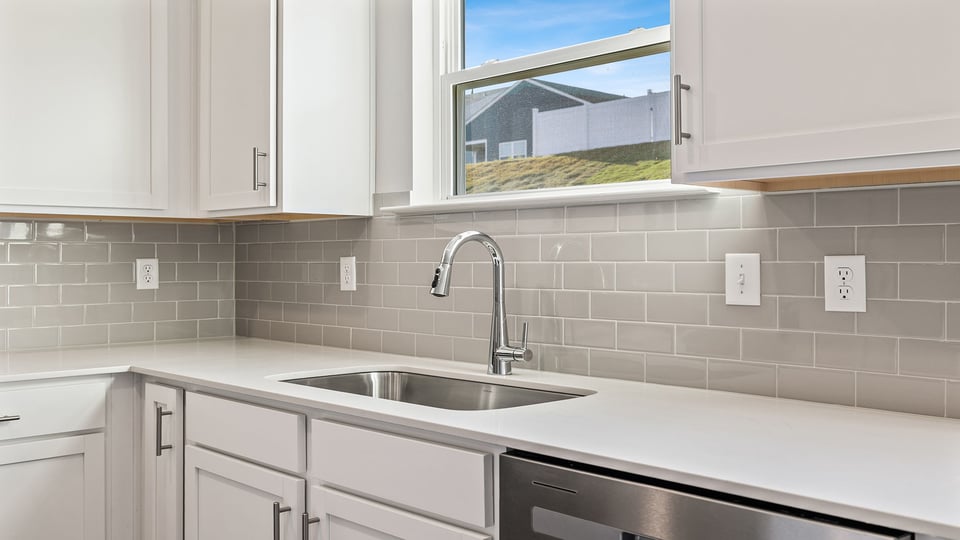 Kitchen with granite countertops and stainless steel appliances.