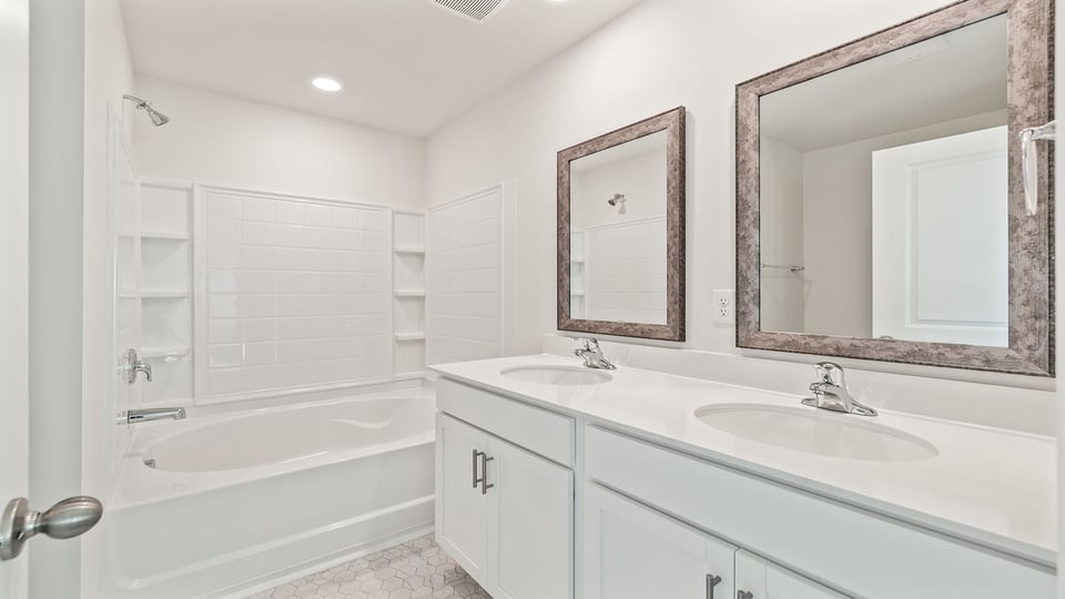 Bathroom with vanity and tub.