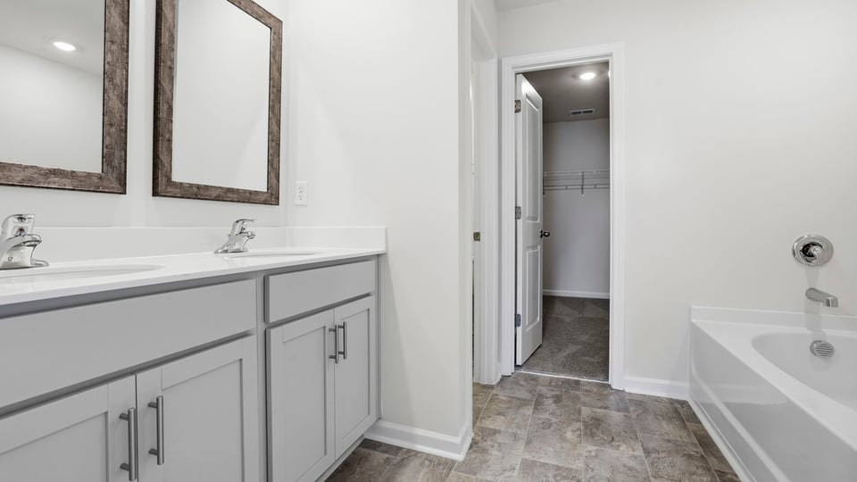 Bathroom with vanity and walk in shower.