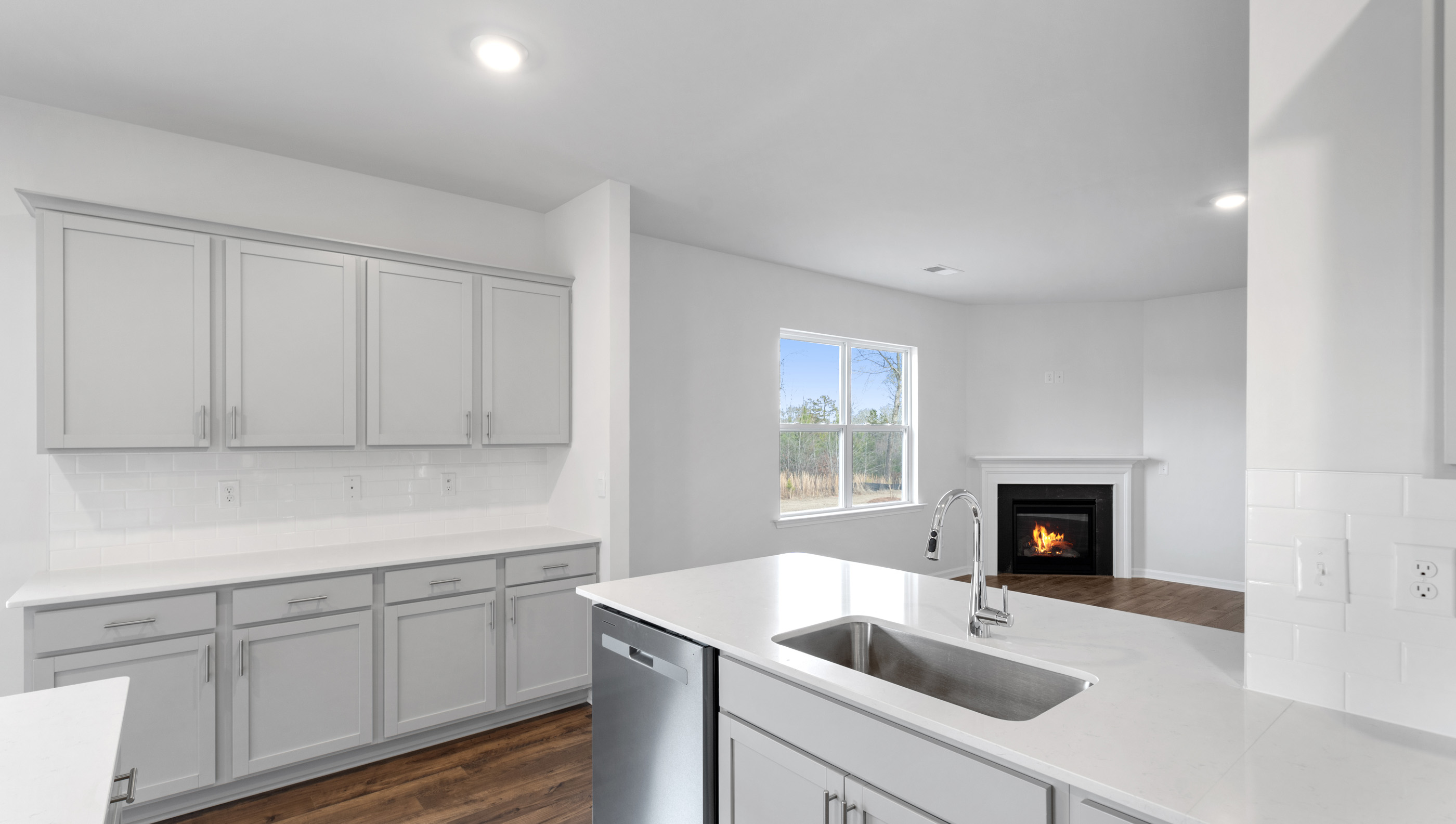 Kitchen with view of family room.