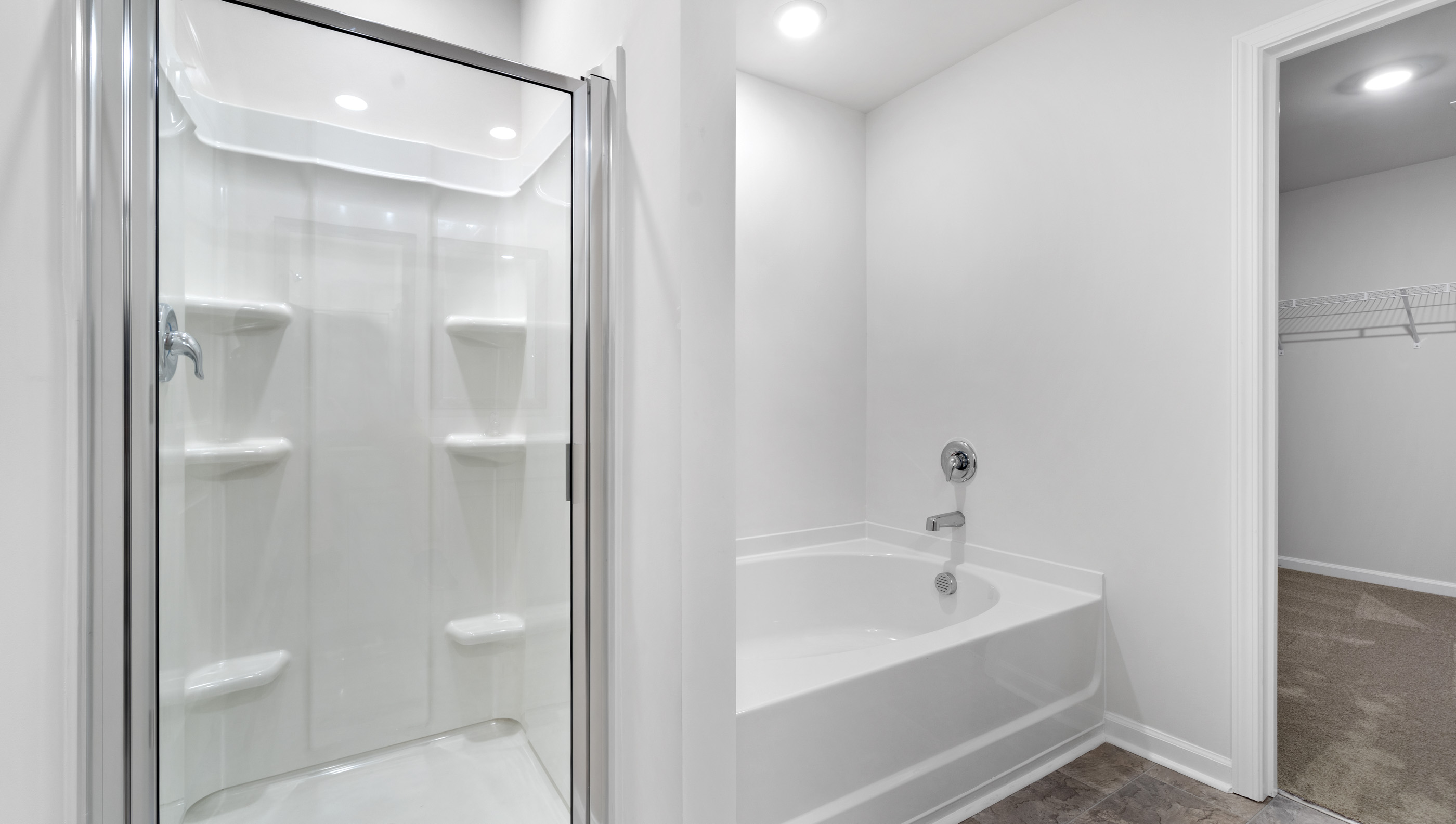Bathroom with walk in shower and tub.
