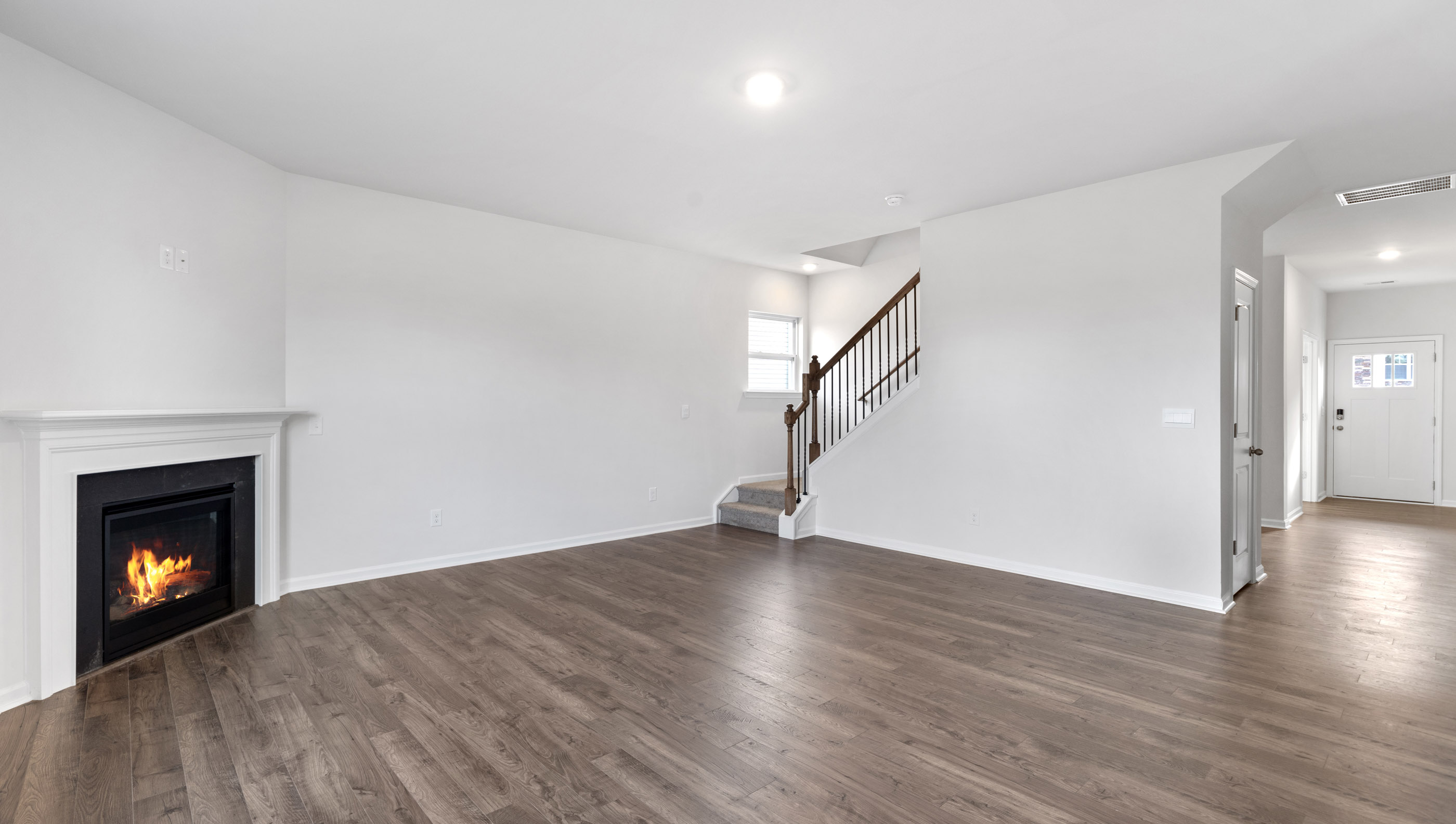 Family room with fireplace and windows.