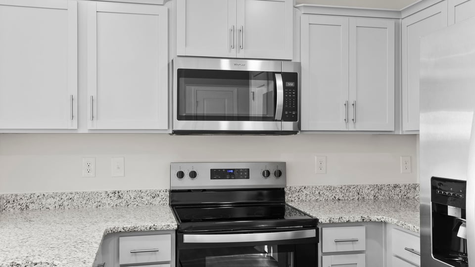 Kitchen with stainless steel appliances and granite counter tops.