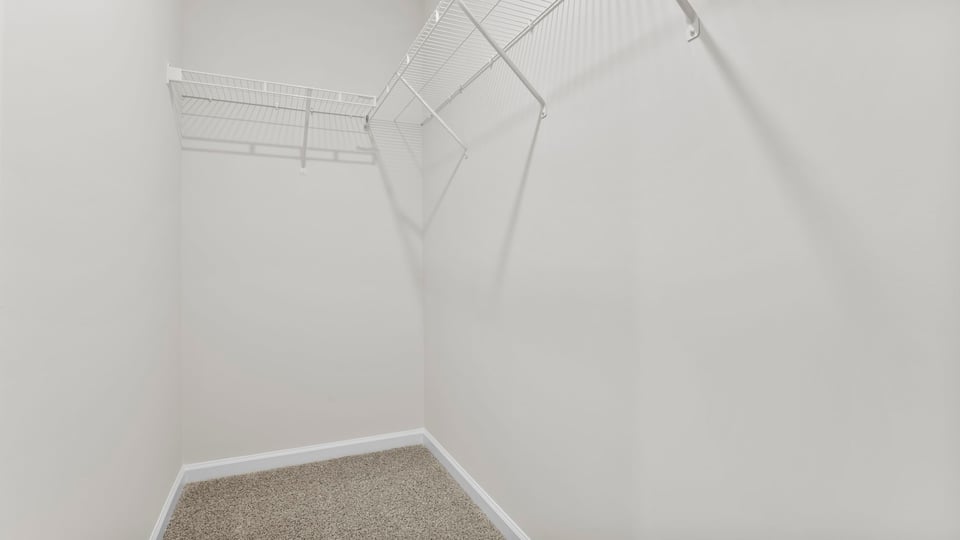 Closet with hanging storage racks.